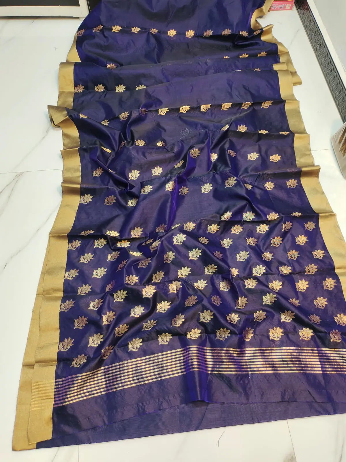 Regal Indigo with Antique Gold Floral Buttis and Zari Border Pattu Silk